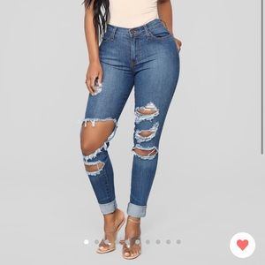 New with tags, mid rise jeans in medium wash.